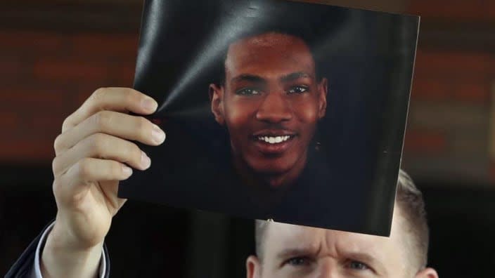 Bobby DiCello, the attorney representing the family of Jayland Walker, holds up Walker’s photograph Sunday before he and his legal team give their statements after the City of Akron’s news conference at the Firestone Park Community Center in Akron, Ohio. (Photo: Karen Schiely/Akron Beacon Journal via AP)