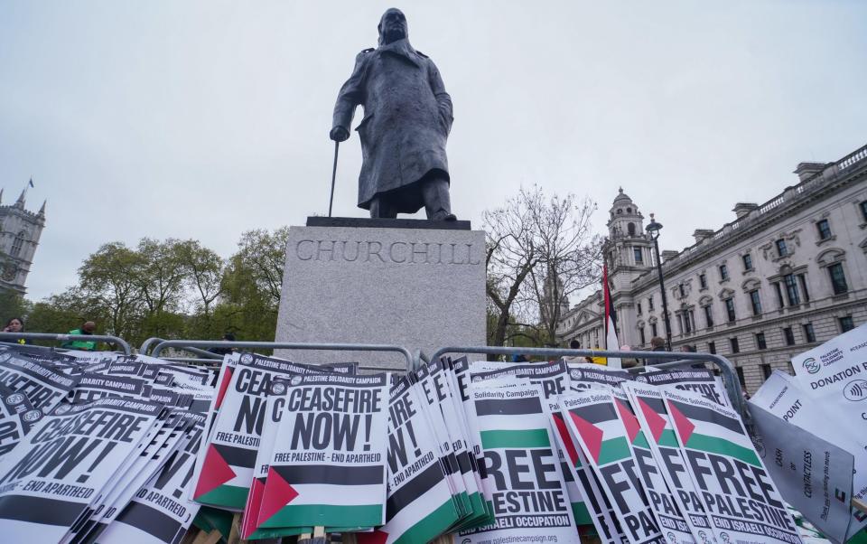 Palestine signs are placed at the Sir Winston Churchill statue in Parliament Square