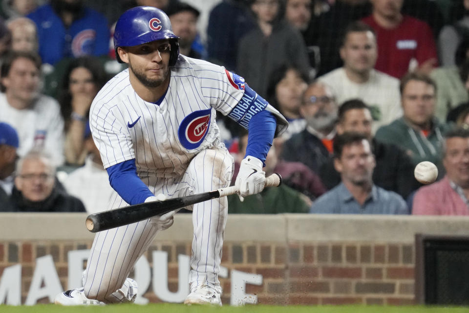 Chicago Cubs' Nick Madrigal hits a sacrifice bunt during the fifth inning of a baseball game against the Pittsburgh Pirates in Chicago, Thursday, June 15, 2023. (AP Photo/Nam Y. Huh)
