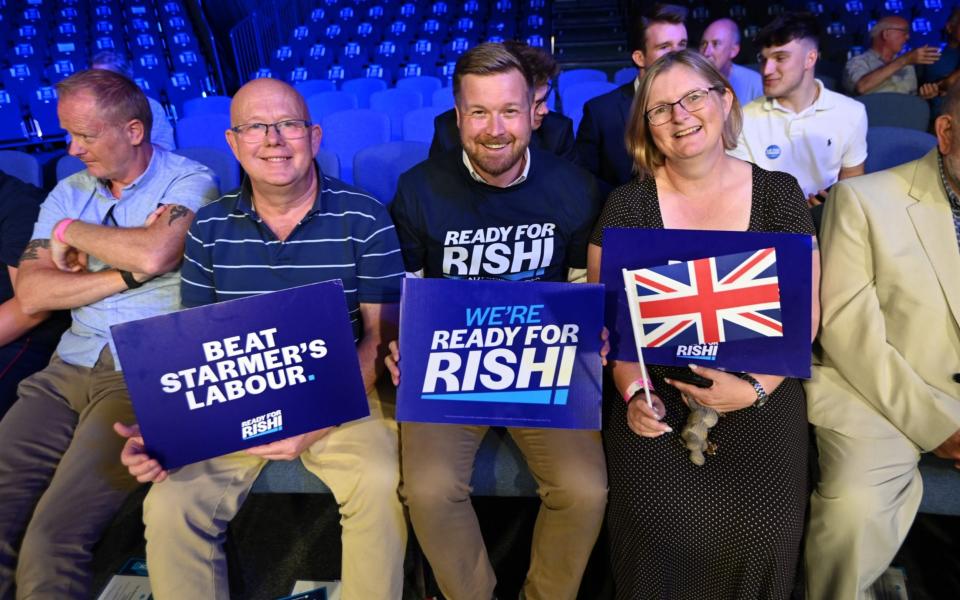 Tory members prepare for this evening's hustings event in Cheltenham - Eddie Mulholland for The Telegraph