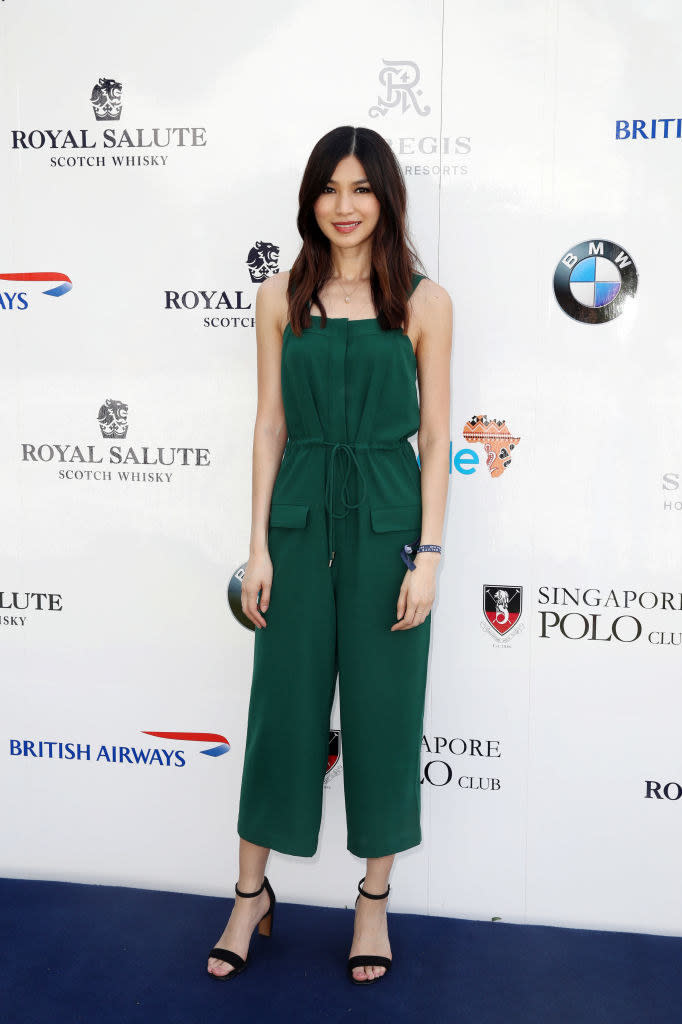 Gemma wearing a green jumpsuit