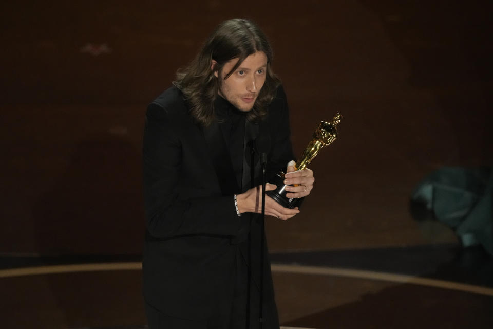 Ludwig Goransson accepts the award for best original score for "Oppenheimer" during the Oscars on Sunday, March 10, 2024, at the Dolby Theatre in Los Angeles. (AP Photo/Chris Pizzello)