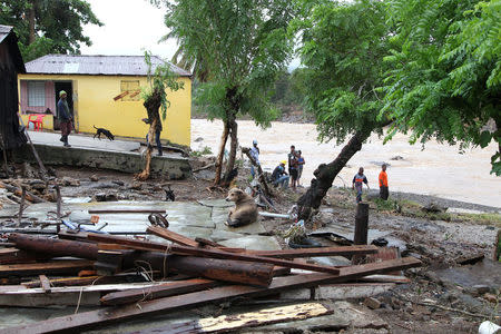 Locals observe the destruction caused by the overflow of the Soco River, in the aftermath of Hurricane Maria, in El Seibo, Dominican Republic, September 22, 2017. REUTERS/Ricardo Rojas