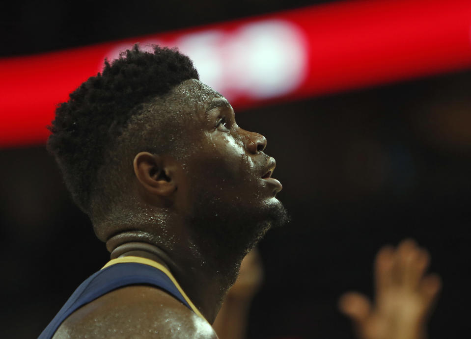 SAN ANTONIO,TX - OCTOBER 13:  Zion Williamson #1  of the New Orleans Pelicans watches a foul shot taken against the San Antonio Spurs in a pre-season game  at AT&T Center on October 13 , 2019 in San Antonio, Texas.  NOTE TO USER: User expressly acknowledges and agrees that , by downloading and or using this photograph, User is consenting to the terms and conditions of the Getty Images License Agreement. (Photo by Ronald Cortes/Getty Images)