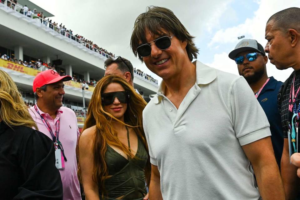 CHANDAN KHANNA/AFP via Getty Shakira and Tom Cruise