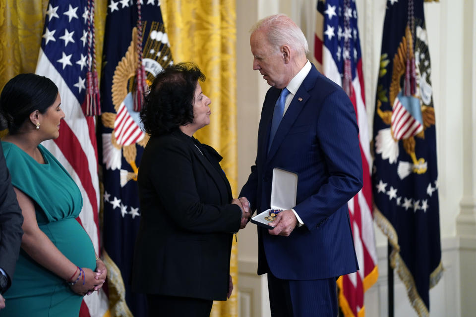 President Joe Biden presents the Medal of Valor, the nation's highest honor for bravery by a public safety officer, to from right, Gabina Mora (Mother), accepting on behalf of Fallen Detective Wilbert Mora of the New York City Police Dept., and Dominique Rivera (Wife), accepting on behalf of Fallen Detective Jason Rivera of the New York City Police Dept., during an event in the East Room of the White House, Wednesday, May 17, 2023, in Washington. (AP Photo/Evan Vucci)