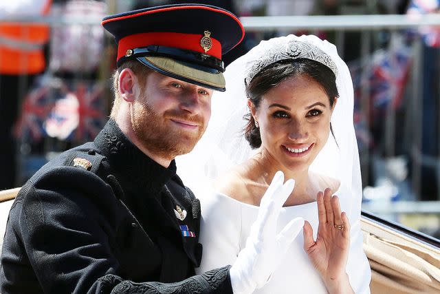 <p>AARON CHOWN/POOL/AFP via Getty</p> Prince Harry and Meghan Markle on their royal wedding day on May 19, 2018