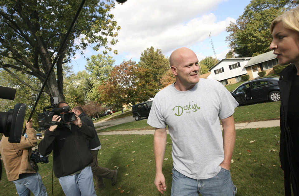 FILE - Joe Wurzelbacher, better known as "Joe the Plumber," talks to a reporter as he walks to a neighbor's home in Holland, Ohio, Oct. 16, 2008. Wurzelbacher, who was thrust into the political spotlight as “Joe the Plumber” after questioning Barack Obama about his economic policies during the 2008 presidential campaign, has died, his son said Monday, Aug. 28, 2023. He was 49. His oldest son, Joey Wurzelbacher, said his father died Sunday, Aug. 27, in Wisconsin after a long illness. (AP Photo/Madalyn Ruggiero, File)