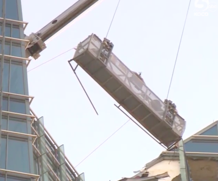 The lift holding two window washers at Oklahoma City’s Devon Tower became unsecured on Wednesday, prompting a dramatic rescue caught on video. (Photo: Courtesy of KOCO-TV)