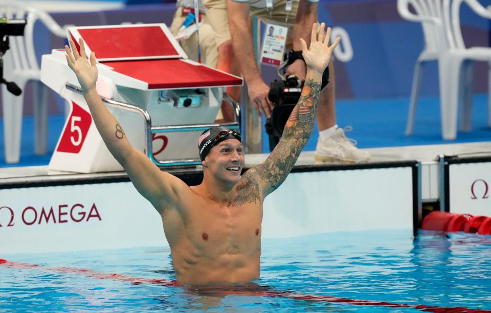 Caeleb Dressel celebrates after winning the men's 100-meter freestyle.