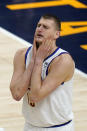 Denver Nuggets center Nikola Jokic reacts after fouling a Utah Jazz player during the first half of an NBA basketball game Friday, May 7, 2021, in Salt Lake City. (AP Photo/Rick Bowmer)