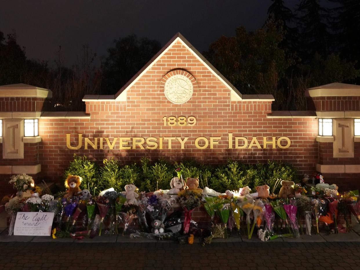 Flowers and other items are displayed at a growing memorial in front of a campus entrance sign for the University of Idaho, Wednesday, Nov. 16, 2022, in Moscow, Idaho.