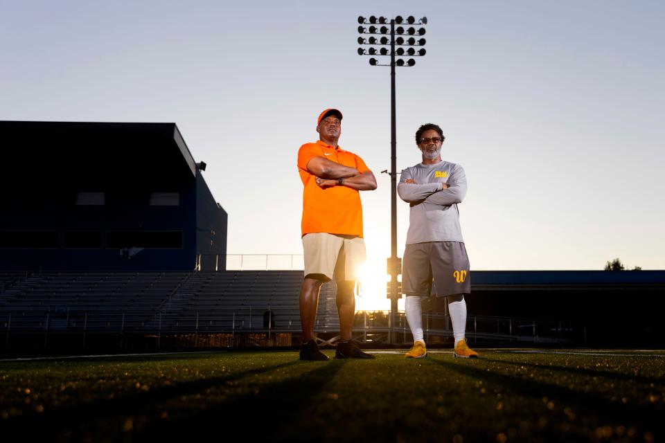 Putnam City football coach Willis Alexander, left, and Putnam West coach Gregory Johnson pose for a photo at Putnam West on Wednesday. The two coaches face off Friday night.