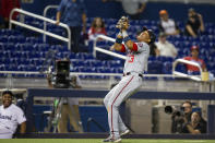 Washington Nationals second baseman Starlin Castro (13) laughs as he catches a pop fly during the ninth inning of a baseball game against the Miami Marlins on Thursday, June 24, 2021, in Miami. (AP Photo/Mary Holt)