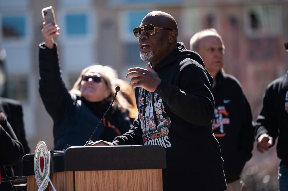 North High boys' basketball coach Al Pettway speaks during the rolling rally.