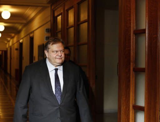 Greek Minister of Finance Evagelos Venizelos (R) arrives for a cabinet meeting in Athens. The greek coalition government suffered the loss of 2 ministers and 4 deputy ministers in 24 hours, as the new austerity measures triggered political crisis and widepread unrest