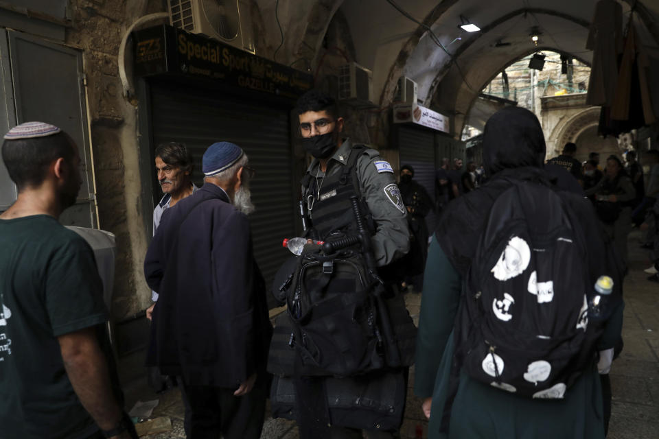 An Israeli border police officer works in the Old City of Jerusalem, Friday, Sept. 10, 2021. Amid increased Israeli-Palestinian tension over a recent prison break, Israeli police said an officer was lightly injured by a firearm in an attempt to thwart a suspected stabbing attack in the area. The Police, which arrested the suspect, did not immediately say how the officer was injured. (AP Photo/Mahmoud Illean)