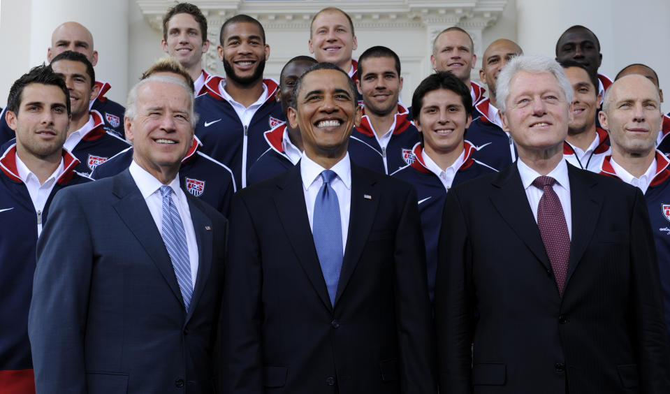 FILE - President Barack Obama, flanked by Vice President Joe Biden, left, and former President Bill Clinton, right, pose for a photo with the U.S. World Cup soccer team under the North Portico of the White House in Washington, May 27, 2010. President Joe Biden will share a stage with Barack Obama and Bill Clinton on Thursday in New York as he raises money for his reelection campaign. It's a one-of-a-kind political extravaganza that will showcase decades of Democratic leadership. (AP Photo/Susan Walsh, File)