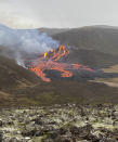 This image provided by the Icelandic Coast Guard shows a volcano on the Reykjanes Peninsula in southwestern Iceland on Saturday March 20, 2021. A long dormant volcano on the Reykjanes Peninsula flared to life Friday night, spilling lava down two sides in that area's first volcanic eruption in nearly 800 years. Initial aerial footage, posted on the Facebook page of the Icelandic Meteorological Office, showed a relatively small eruption so far, with two streams of lava running in opposite directions. (Icelandic Coast Guard via AP)