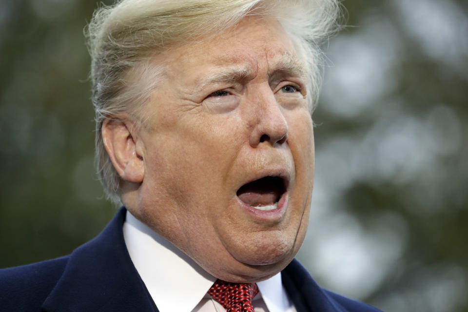 President Donald Trump talks to the media before boarding Marine One on the South Lawn of the White House, Friday, Nov. 9, 2018, in Washington. (AP Photo/Evan Vucci)