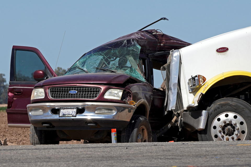 A maroon Ford Expedition which had been crammed with more than two dozen people is seen after it was involved in a deadly collision with a semitruck near Holtville, California, on Tuesday, March 2, 2021. / Credit: Bing Guan / Reuters