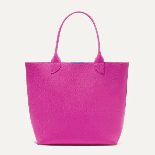 <p><a href="https://go.redirectingat.com?id=74968X1596630&url=https%3A%2F%2Frothys.com%2Fproducts%2Fthe-lightweight-tote-dragon-fruit&sref=https%3A%2F%2Fwww.womansday.com%2Fstyle%2Fg60814836%2Fbest-beach-totes%2F" rel="nofollow noopener" target="_blank" data-ylk="slk:Shop Now;elm:context_link;itc:0;sec:content-canvas" class="link ">Shop Now</a></p><p>The Lightweight Tote</p><p>$149.00</p><span class="copyright">Rothy's</span>