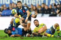 Montpellier's Benoit Paillaugue (C) clears the ball out of a scrum during the rugby match against Clermont on January 30, 2016