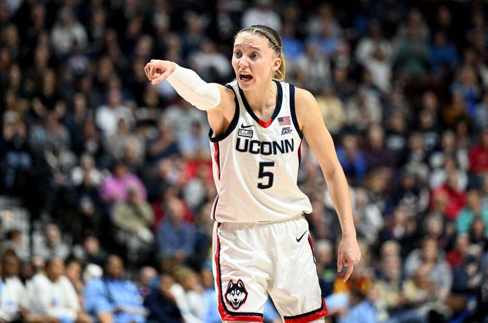 UConn's Paige Bueckers motions to her teammates during a game against North Carolina at Mohegan Sun Arena in Uncasville, Connecticut, on Dec. 10, 2023, as part of the Women's Hall of Fame Showcase. (Photo by G Fiume/Getty Images)