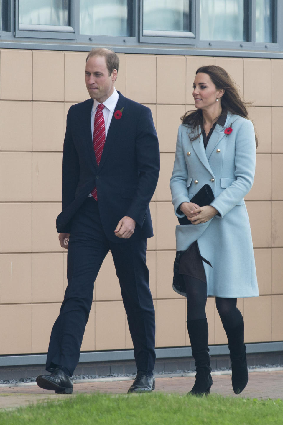 <p>The Duchess debuted a pale blue coat by British designer Matthew Williamson for a day in Wales. Underneath, she wore a brown shirt dress from Hobbs and accessorised with Aquatalia heeled boots and a Stuart Weitzman clutch. </p><p><i>[Photo: Getty]</i></p>