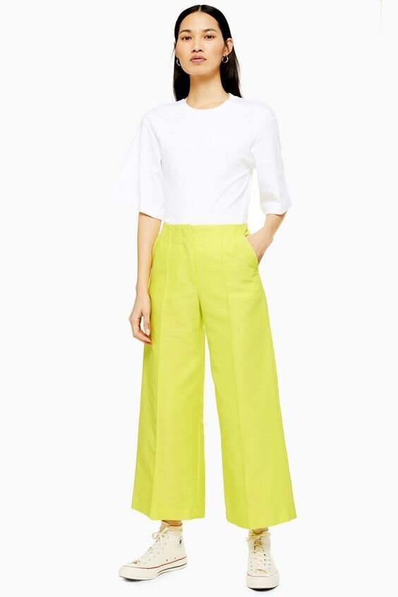 <strong><a href="https://us.topshop.com/en/tsus/product/neon-awkward-cropped-trousers-by-boutique-8718950?Ntt=neon" target="_blank" rel="noopener noreferrer">Get the Neon cropped trousers by Boutique for $150.</a></strong>