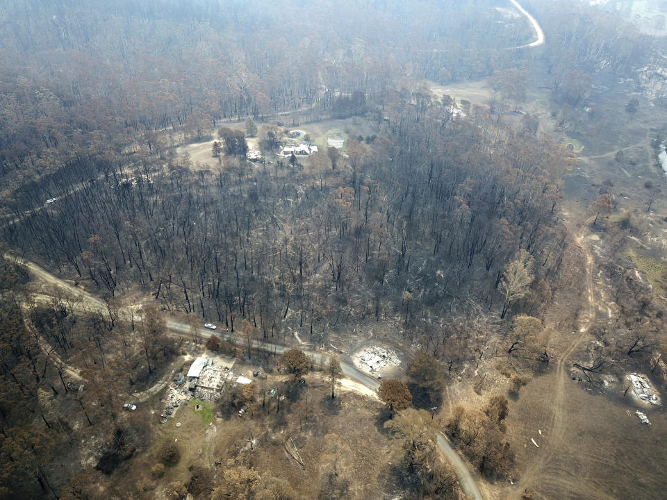 Properties at Nerrigundah, Australia, Monday, Jan. 13, 2020, are damaged and destroyed after a wildfire ripped through the town on New Year's Eve. The tiny village of Nerrigundah in New South Wales has been among the hardest hit by Australia's devastating wildfires, with about two thirds the homes destroyed and a 71-year-old man killed. (AP Photo/Sam McNeil)