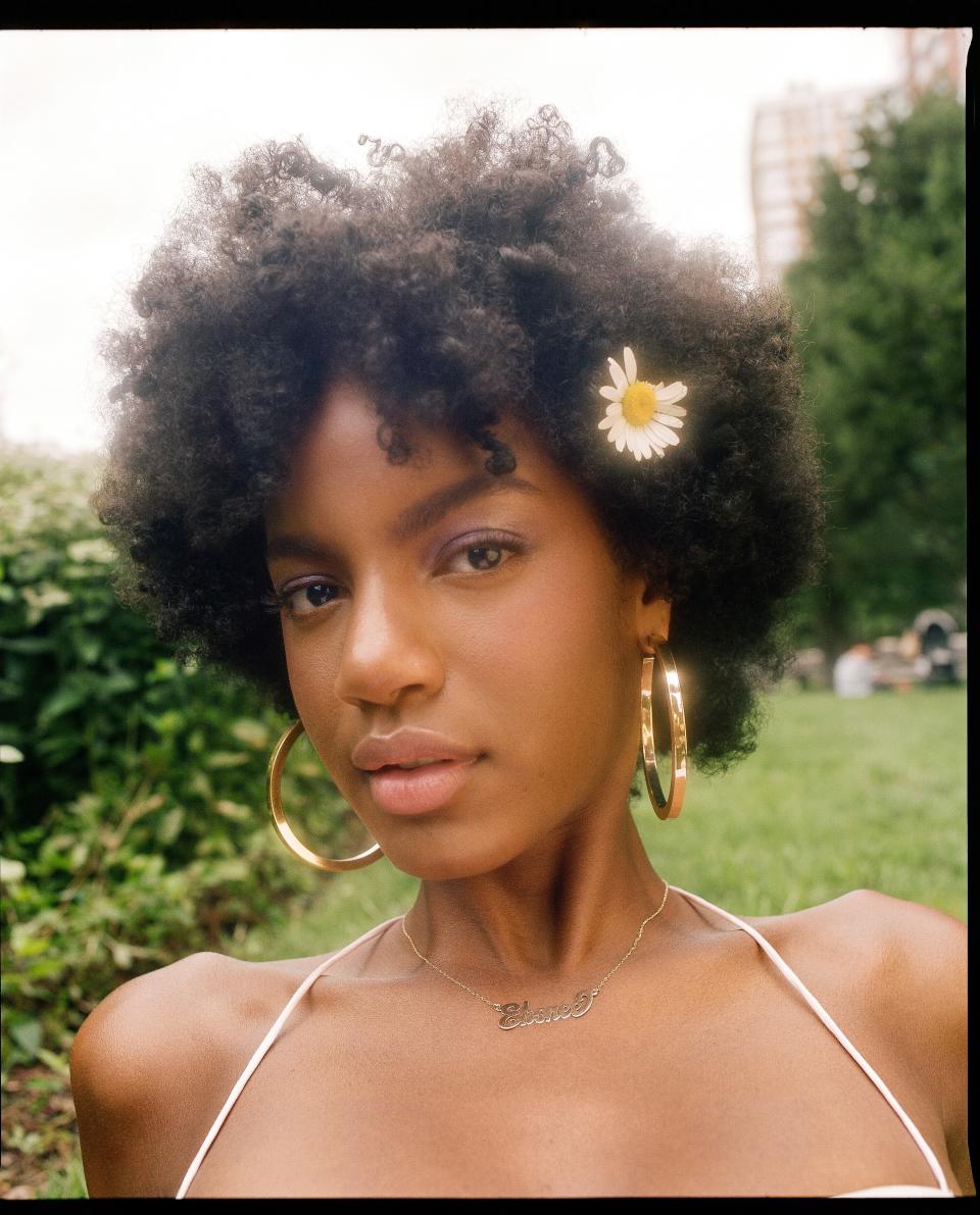 <h1 class="title">Redefining Good Hair 2018: Ebonee Davis</h1> <cite class="credit">Orseund Iris top, Jennifer Fisher earrings, model's own necklace.</cite>