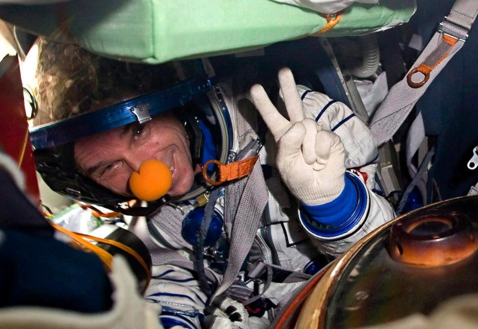 Space tourist Canadian billionaire and clown Guy Laliberte shows A victory sign while sitting inside the Soyuz TMA-14 spacecraft shortly after his landing with the members of the main mission to the International space station, Russian cosmonaut Gennady Padalka and NASA astronaut Michael Barratt, not seen, near the town of Arkalyk, Kazakhstan, on Sunday, Oct. 11, 2009. The federal tax court says the out-of-this-world trip taken by Quebec billionaire Guy Laliberte in 2009 is taxable. THE CANADIAN PRESS/AP-Sergei Remezov, Pool