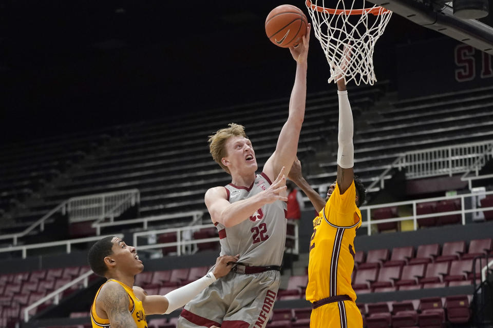 Stanford forward James Keefe (22) scores between Arizona State forwards Jalen Graham, left, and Alonzo Gaffney during the second half of an NCAA college basketball game in Stanford, Calif., Saturday, Jan. 22, 2022. (AP Photo/Jeff Chiu)