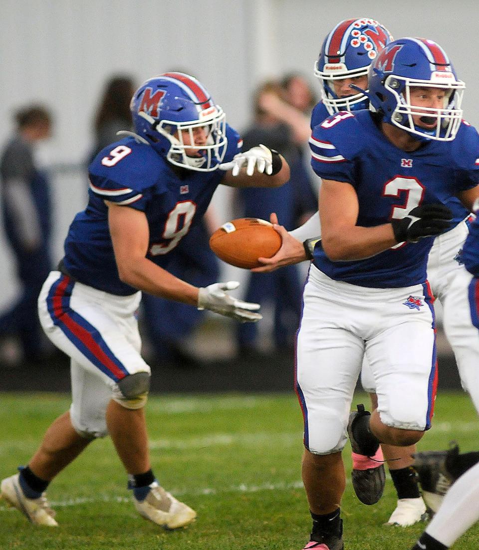 Mapleton High School's Kollin Cline (5) hands off to Mapleton High School's Luke Pryor (9) behind a block from Mapleton High School's Brycn Cucco (3)during football action between Plymouth and Mapleton at John E Camp Stadium  Friday September 30,2022  Steve Stokes/for Ashland Times-Gazette