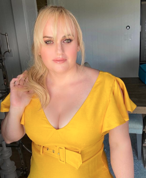 Rebel Wilson in a belted yellow dress