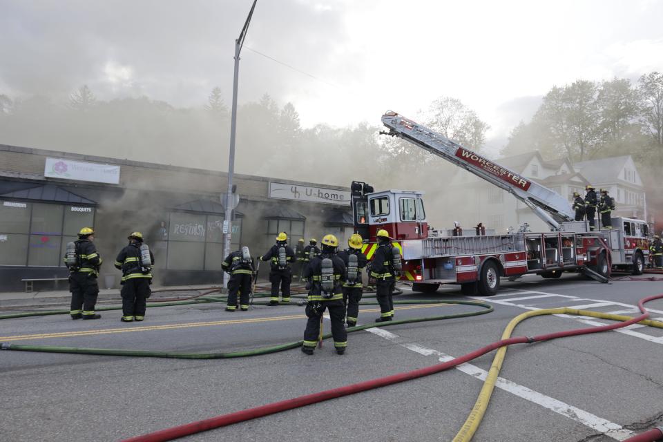 Firefighters respond to the fire on Pleasant Street