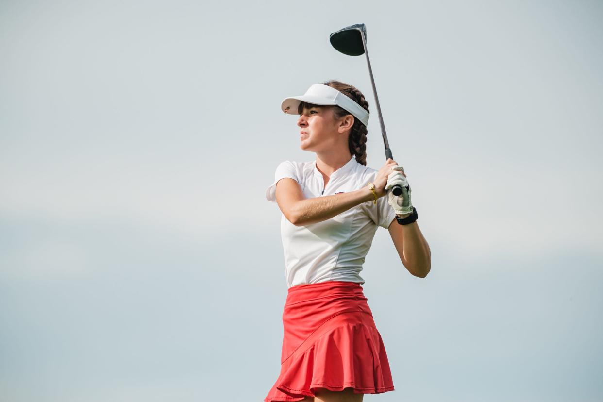 Garaway High School's Sammi MIller competes during Division II Girls District Golf competition at Cambridge Country Club last season.