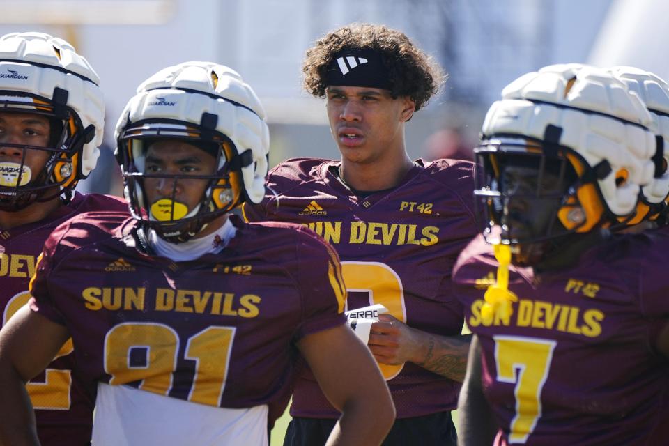 ASU wide receiver Jordyn Tyson (0) listens to receivers coach Hines Ward during a spring practice at the Kajikawa practice fields in Tempe on April 16, 2024.