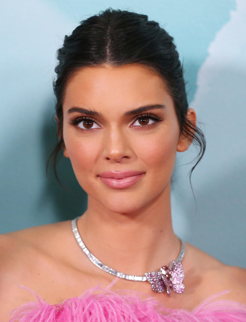 A close-up of the pink and silver butterfly pendant. (Photo: Don Arnold via Getty Images)