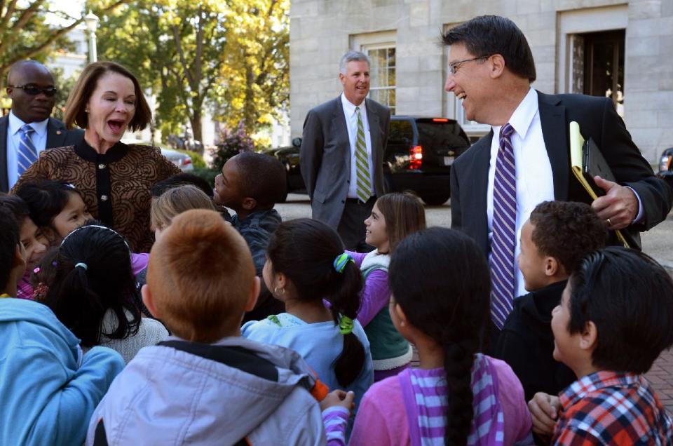 Governor-elect Pat McCrory tells school children from Dillard Elementary School to hug the new first lady, his wife Ann, after their meeting with Gov. Bev Perdue Thursday Nov. 8, 2012, in Raleigh, N.C. McCrory was in Raleigh to set up his transition office, meet with Perdue and hold his first news conference. (AP Photo/The News & Observer, Chuck Liddy)