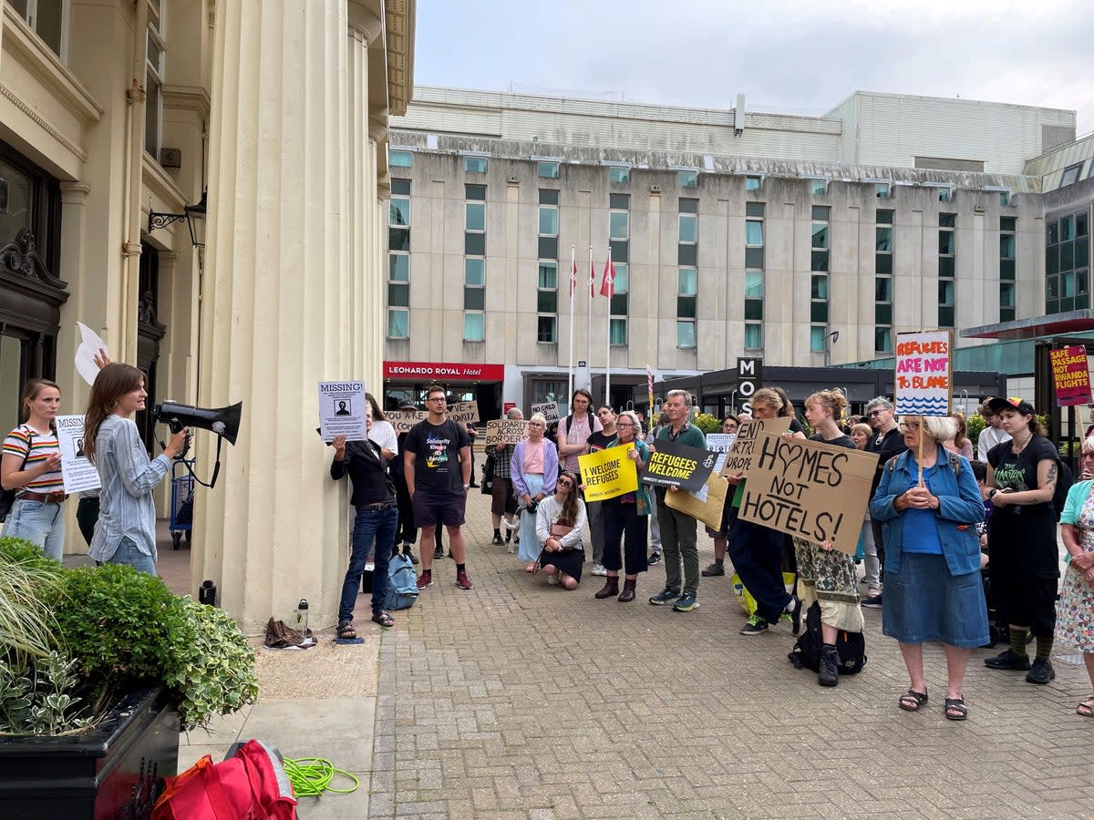 Protesters in Brighton gather over a hotel reopening where asylum-seeking children went missing  (Anahita Hossein-Pour /PA Wire)