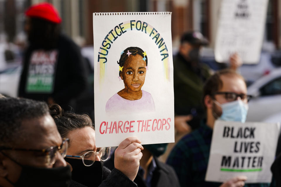 FILE - Protesters call for police accountability in the death of 8-year-old Fanta Bility, who was shot outside a football game, at the Delaware County Courthouse in Media, Pa., on Jan. 13, 2022. Three former police officers, who had been charged in the killing of the 8-year-old girl after they opened fire in the direction of a crowd leaving a high school football game in a suburban Philadelphia town, pleaded guilty Thursday, Nov. 10, to 10 counts each of reckless endangerment. (AP Photo/Matt Rourke, File)