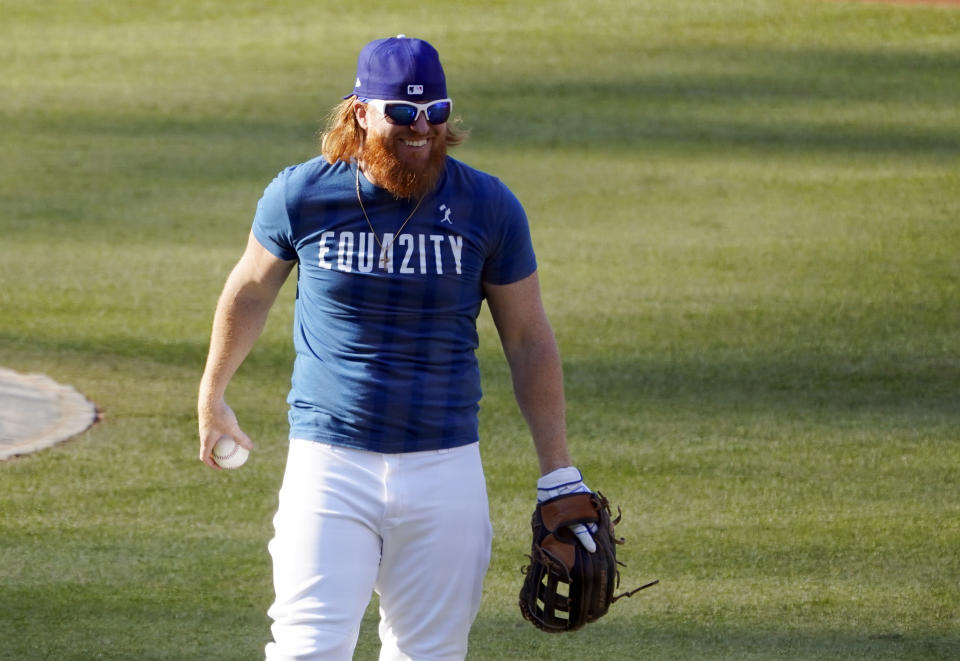 Los Angeles Dodgers' Justin Turner smiles during a workout, Tuesday, Sept. 29, 2020, at Dodger Stadium in Los Angeles, ahead of Wednesday's Game 1 of a National League wild-card baseball series against the Milwaukee Brewers. (AP Photo/Chris Pizzello)