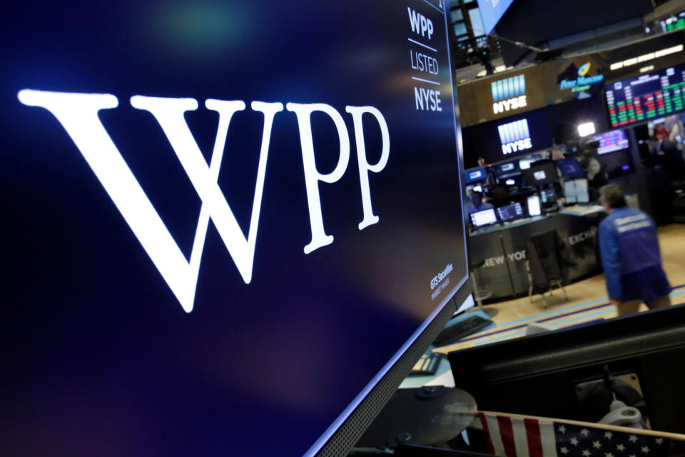 The logo for WPP appears above a trading post on the floor of the New York Stock Exchange, Wednesday, April 4, 2018. Shares in WPP, the world's largest advertising agency, have fallen after an announcement that the board is investigating an allegation of personal misconduct against its chief executive, Martin Sorrell. (AP Photo/Richard Drew)