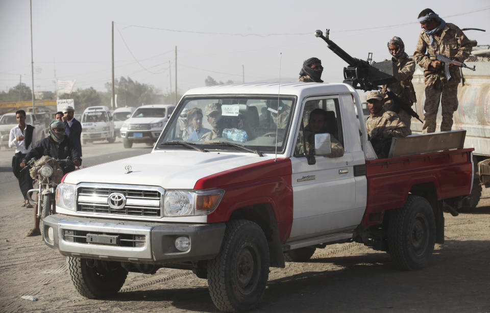 FILE - In this Feb. 2, 2018, file photo, Yemeni soldiers allied to the country's internationally recognized government stand guard in Marib, Yemen. The battle for the ancient desert city has become key to understanding wider tensions now inflaming the Middle East and the challenges facing any efforts by President Joe Biden’s administration to shift U.S. troops out of the region. (AP Photo/Jon Gambrell, File)