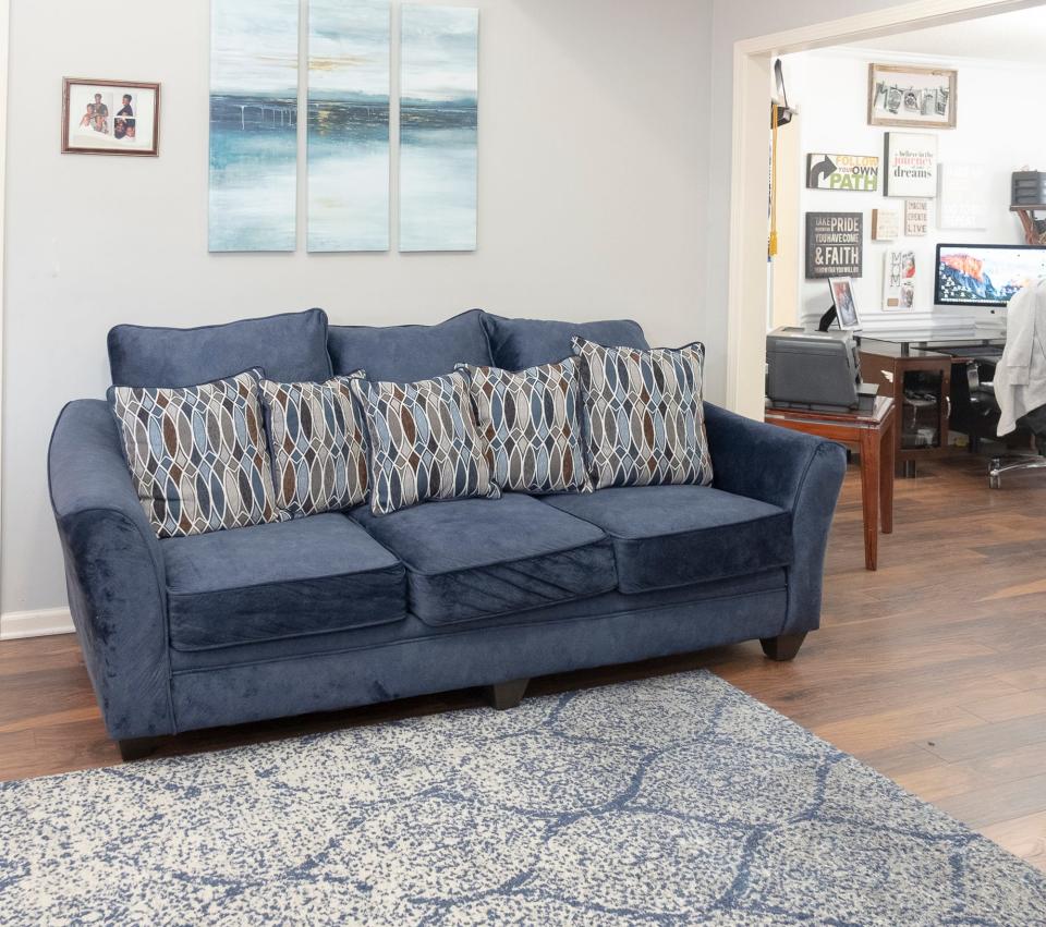 The living room’s color palette is based on comfortable shades of blue.