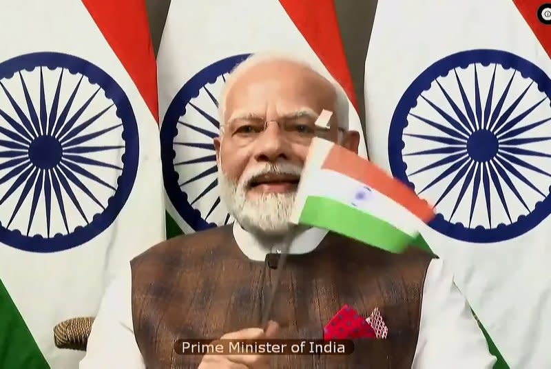 Prime Minister Narendra Modi joined the ISRO via video from South Africa, where he is attending the BRICS Summit, waving the Indian flag as the Chandrayaan-3 safely landed on the moon. Photo by Indian Space Research Organization