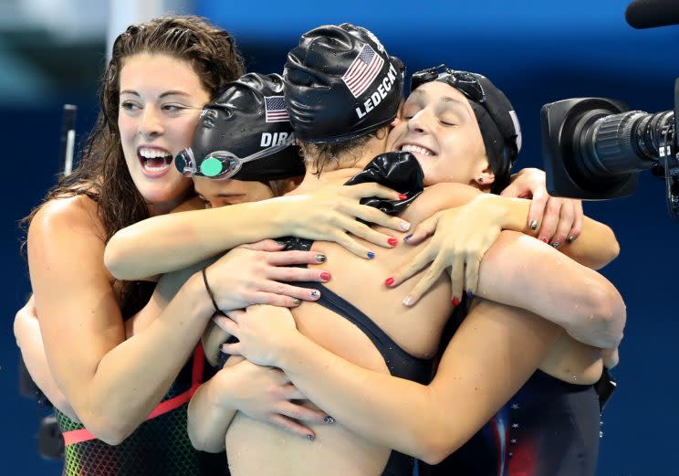 The U.S. 4x200 freestyle relay team celebrates after winning gold Wednesday. (AP)