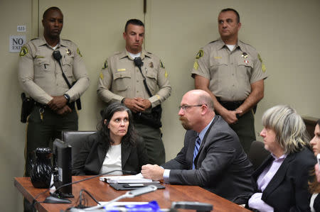 David Turpin (R) and Louise Turpin (2nd L) appear in court for their arraignment in Riverside, California, U.S. January 18, 2018. REUTERS/Frederic J. Brown/Pool